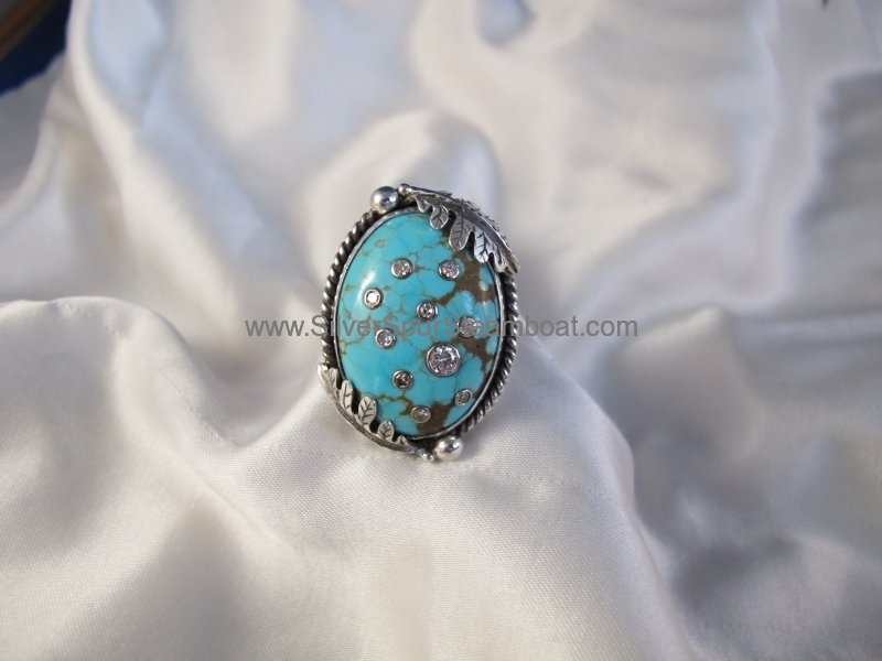 Turquoise custom ring with inlaid Diamonds and Oak leaves