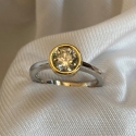 simple-18k-rimmed-diamond-engagement-ring