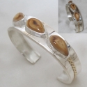 Beautiful narrow two toned Silver and Gild Elk tooth Ivory Bracelet