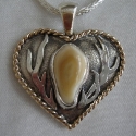 Heart Shaped Elk Tooth pendant with 14k twist trim and antlers