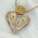 Heart shaped double Elk tooth pendant with 14k trim and bullet casing primer