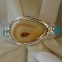 Cast Sterling Silver Elk tooth band style ring with Turquoise